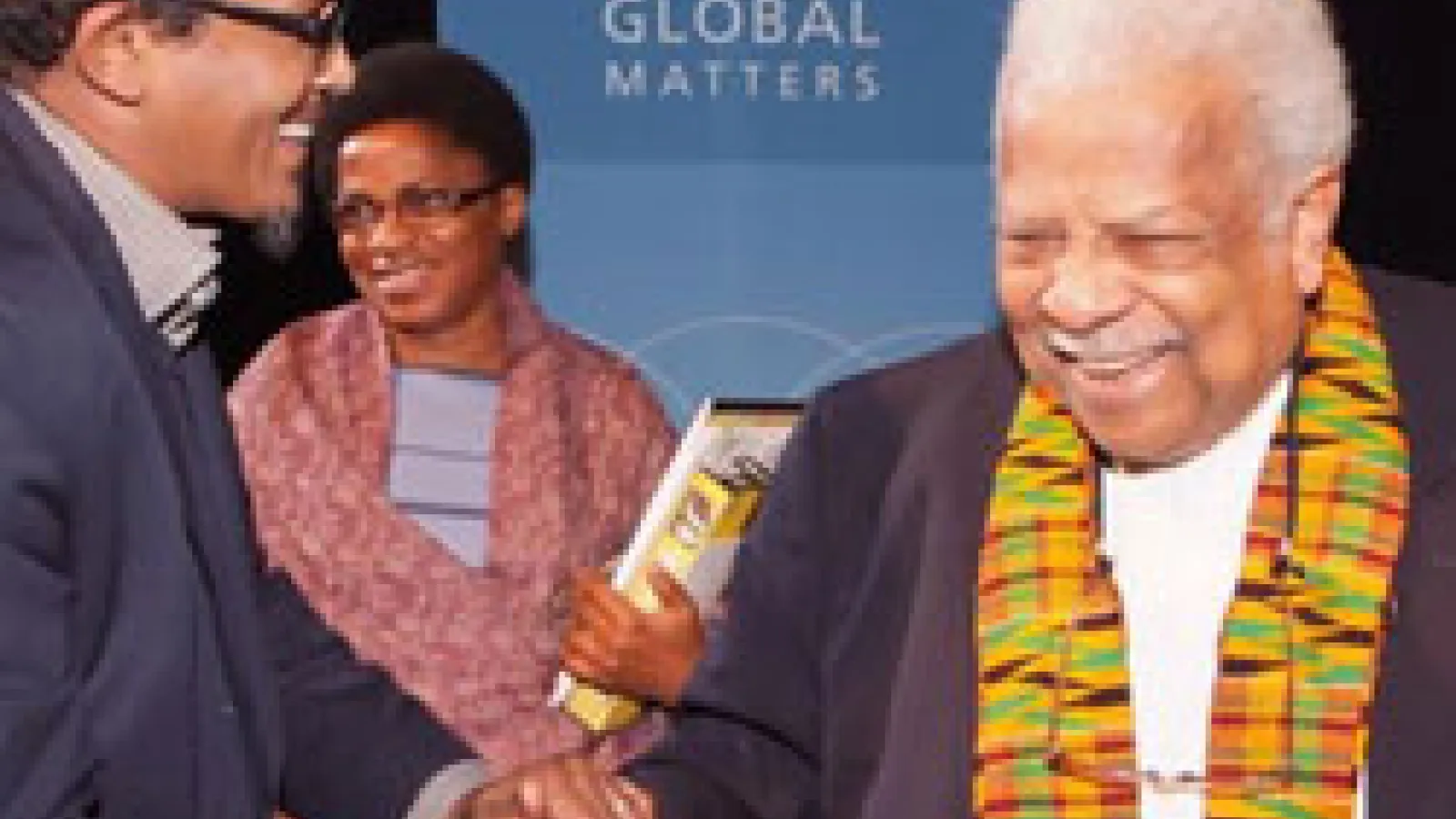 Professor Ali Mazrui shaking hands with participants.