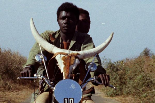 Men on motorcycle in Africa.