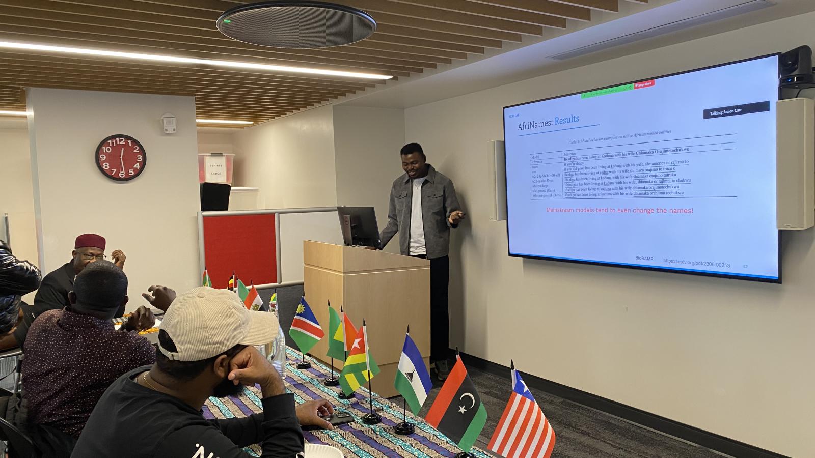 Picture of Abraham Toluwase Owodunni lecturing at Africa at Noon with attendees.